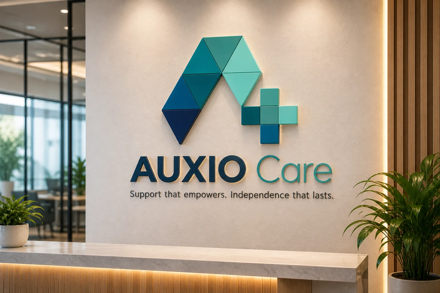 A three-dimensional AUXIO Care logo installed in a welcoming reception area